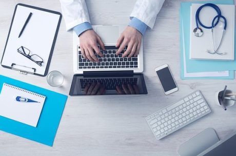 Enrolling in Medicare Doctor Using Laptop