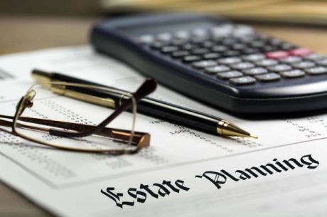 Business Estate Planning Paper, Calculator, Pen and Reading Glasses