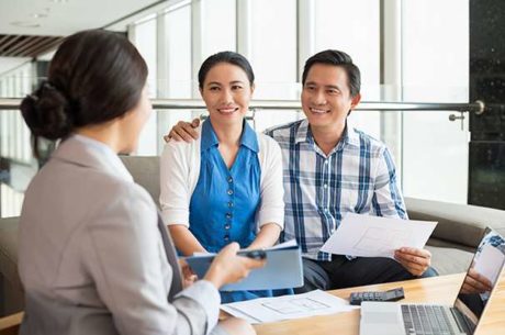 Everyone Needs an Estate Plan With Smiling Couple Meeting With Financial Planner