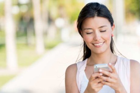 Traveling with Technology With Woman Texting on Mobile Phone