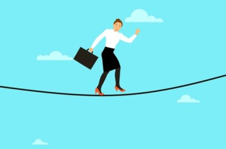 Insuring your business image shows woman with briefcase walking across tightrope