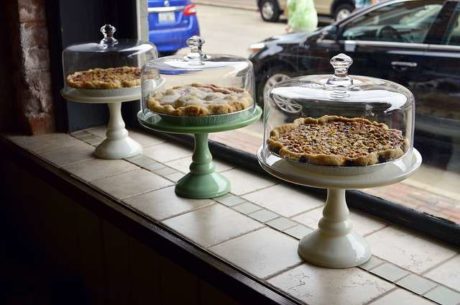 Pie plates in window.
