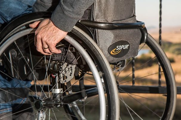 Advanced directives shows older man in a wheelchair.