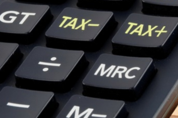 Annuities closeup photo of tax calculator.