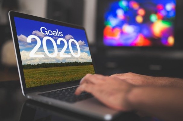 Financial Health photo of computer with goals 2020 on screen.