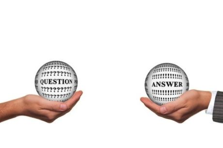 Understanding the New CARES Act Questions and Answers printed balls held in hands.