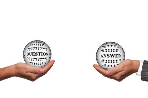 Understanding the New CARES Act Questions and Answers printed balls held in hands.