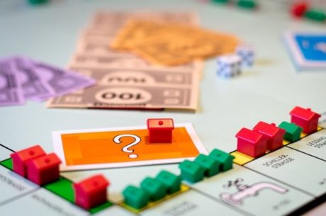 Is Now the Time to Buy or Refinance Depicts Monopoly Game Board.