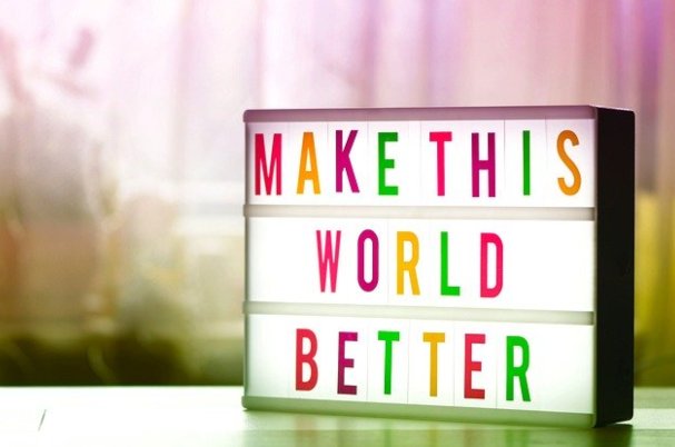 Charitable Giving Incentives depicts sign that says to make this world better.