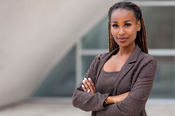 Are You an Intelligent Investor depicts woman grinning at camera.