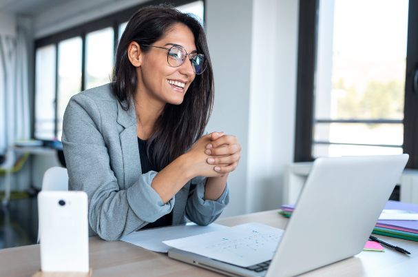 Questions to Explore Before You Meet with Your Estate Planning Attorney Depicts Woman Reading Laptop.
