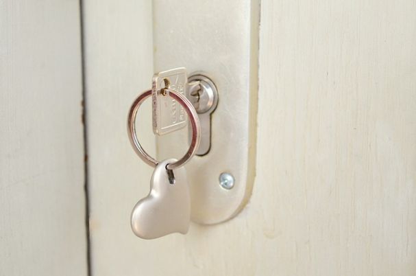 Backdoor Roth IRA Contributions photo shows key in door lock.
