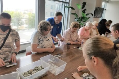 Nickel Campaign with volunteers building Nickel Cards.