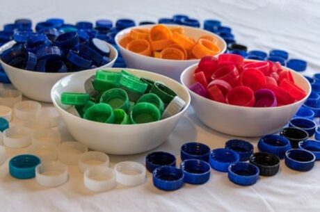 Intro to Asset Allocation Depicts sorting colored bottle caps