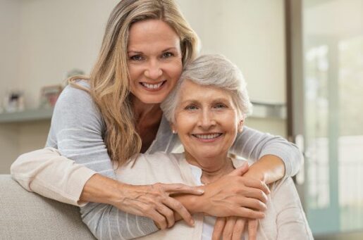 Guide to Medicare Planning with younger woman hugging her elderly mother.