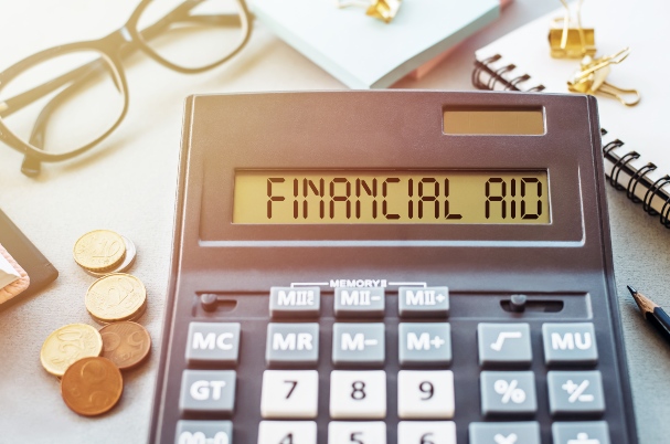 A Crash Course in 529 Plans and Their Impact on Financial Aid photo of calculator.