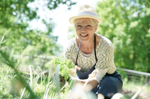 Retirement checklist image depicts an older woman who is gardening.