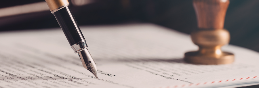 Pen and document represent signing a living trust.