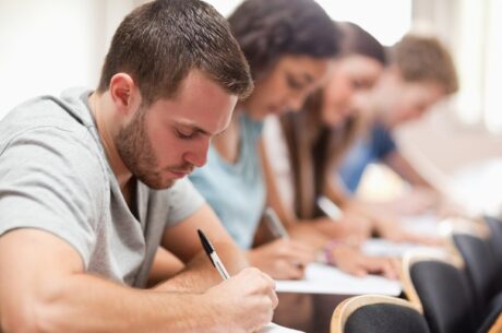 Preparing for College shows Serious students sitting for an examination