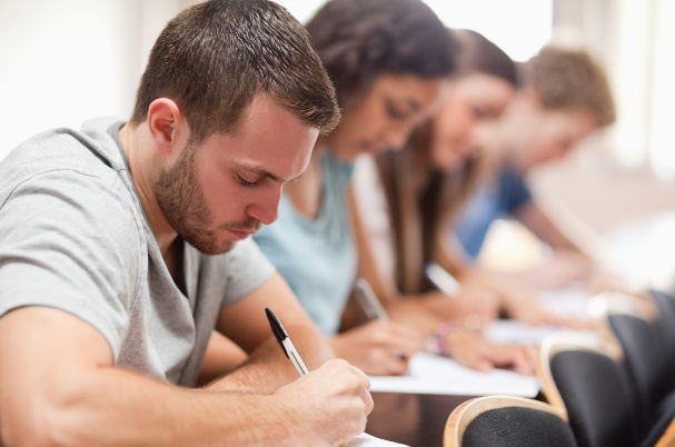 Preparing for College shows Serious students sitting for an examination