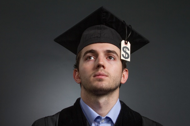 Male college student contemplates student debt relief plans.
