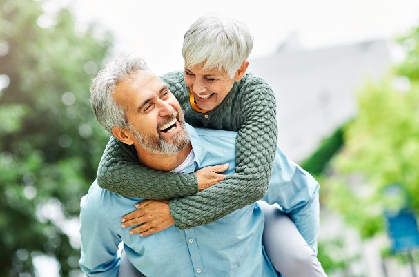 Ready to Retire Photo Concept of Happy active senior couple outdoors