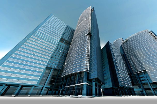 A shot of tall bank buildings depicts The Week of Bank Collapses: A Q&A