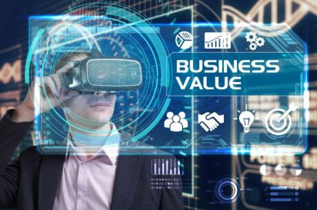 Value Drivers for a Business concept photo depicts technology and network concept. Young businessman working in virtual reality glasses sees the inscription: business value