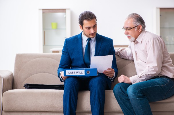 Young lawyer visiting old man in trust executor concept